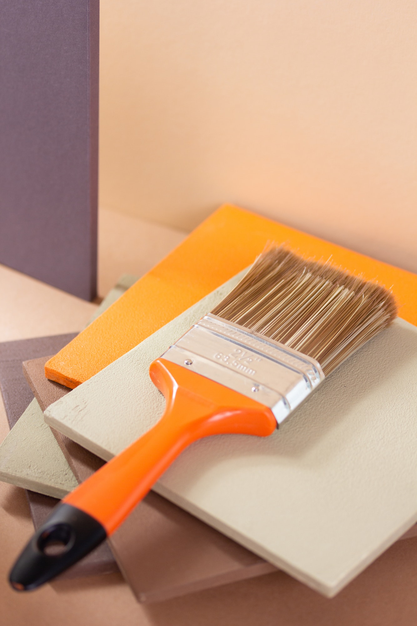 Paintbrush tool at abstract background. Construction paint brush for house renovation